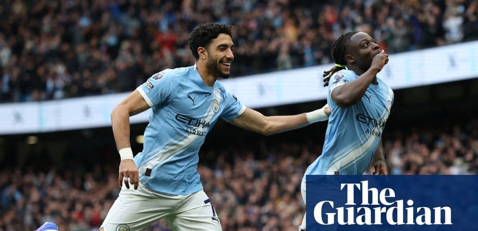 Manchester City players celebrating a goal together