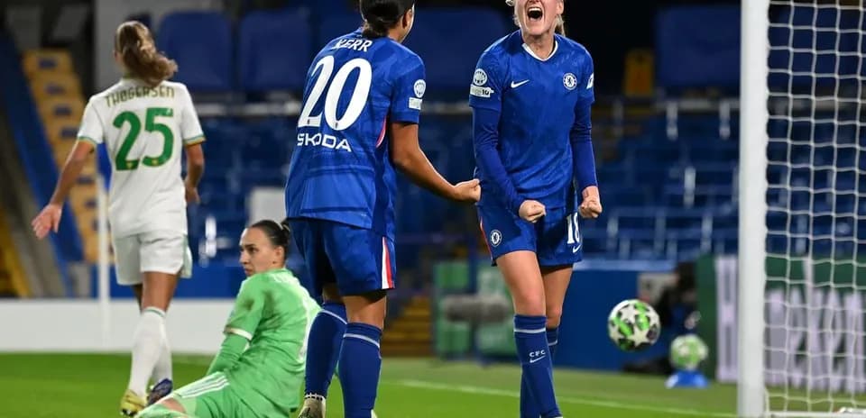 Chelsea players celebrating a goal in Champions League