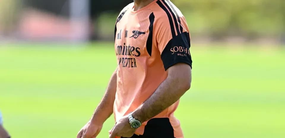 Arsenal manager smiling during training session