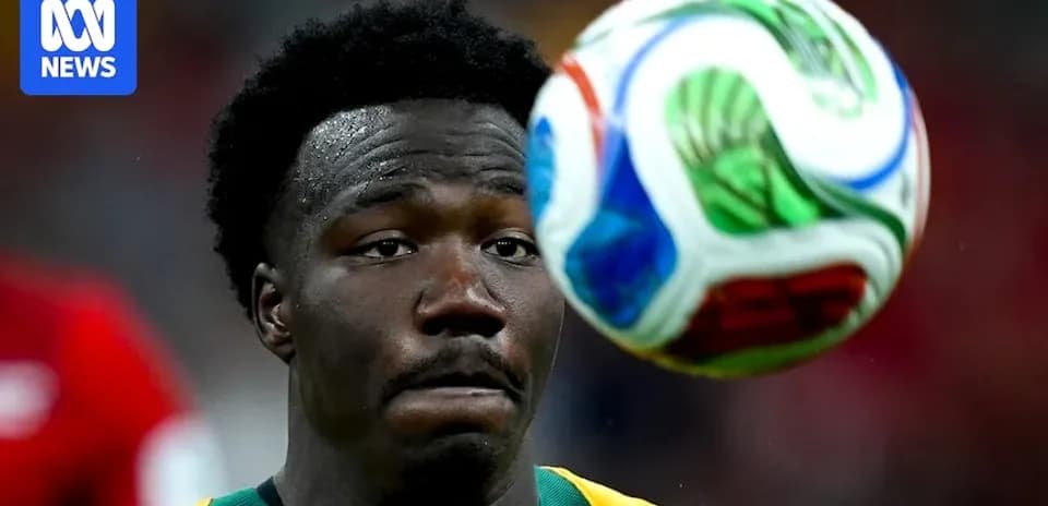 Player watching soccer ball during match