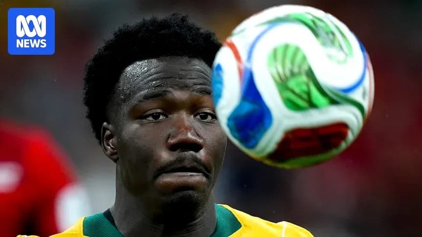 Player watching soccer ball during match