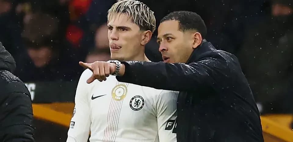 Coach instructing player during match on sidelines