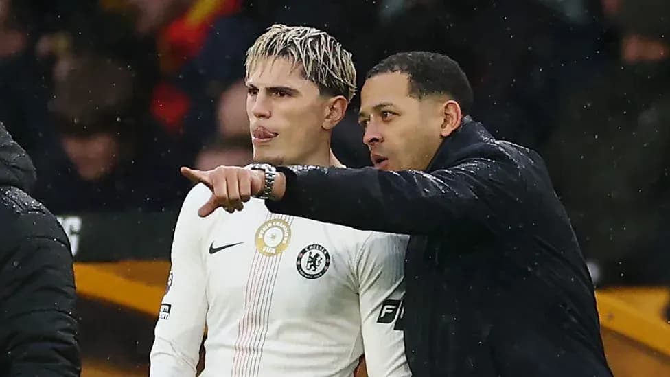Coach instructing player during match on sidelines
