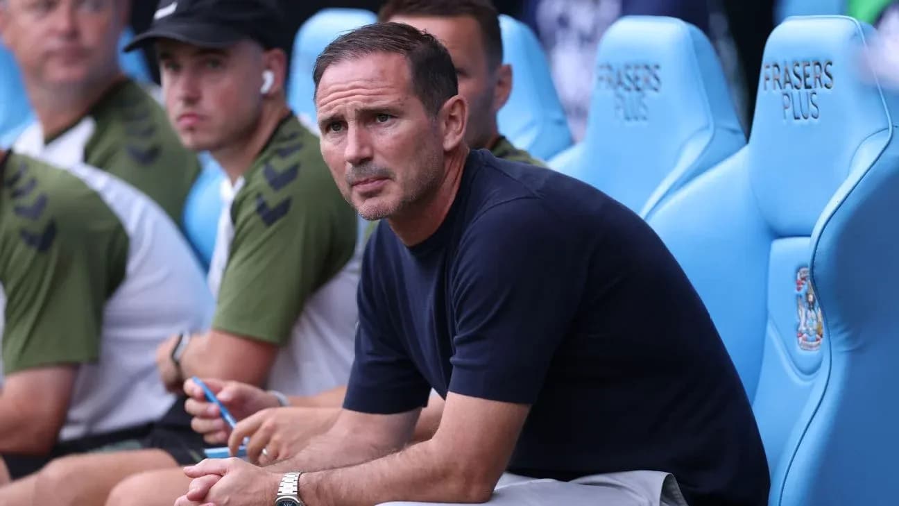 Manager sitting on bench during match