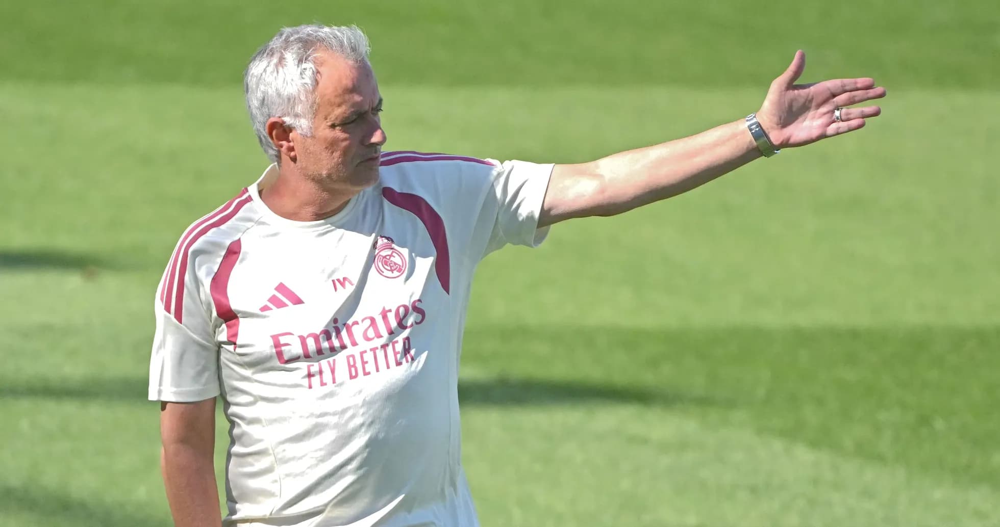 Coach gesturing during training session on field