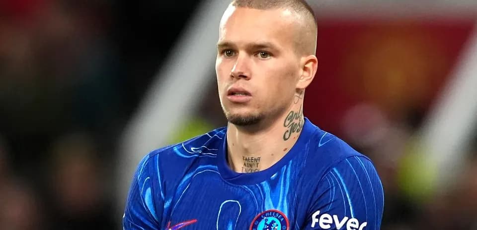 Player in Chelsea kit during match at stadium