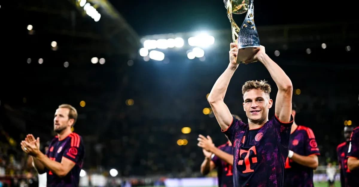 Player holding trophy with teammates celebrating