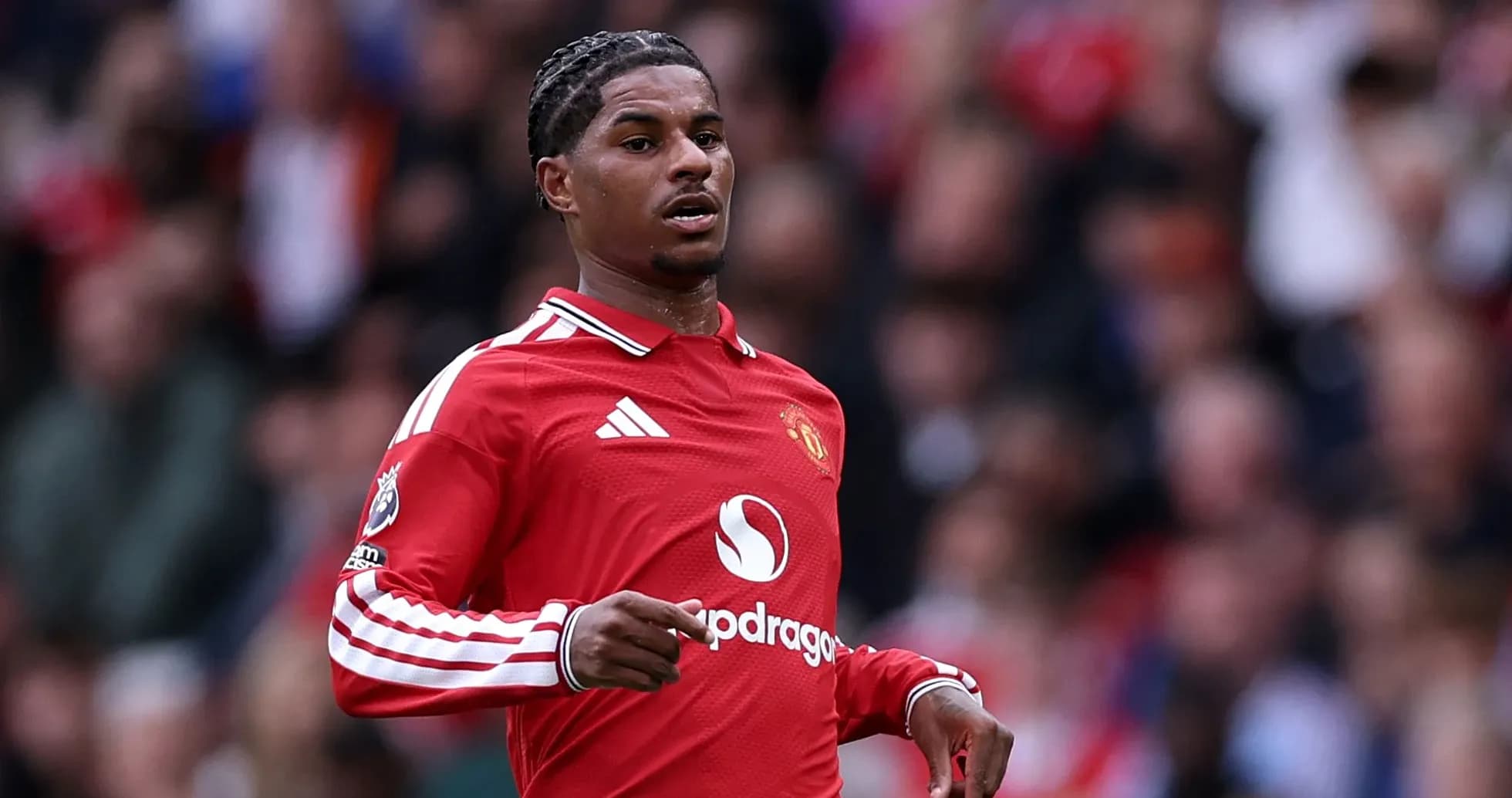 Player in red Manchester United jersey on field