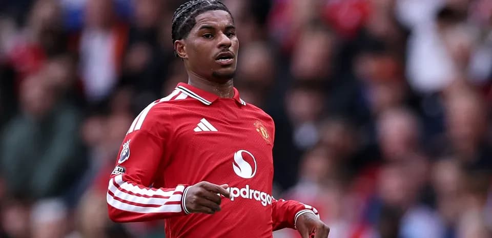 Player in red Manchester United jersey on field
