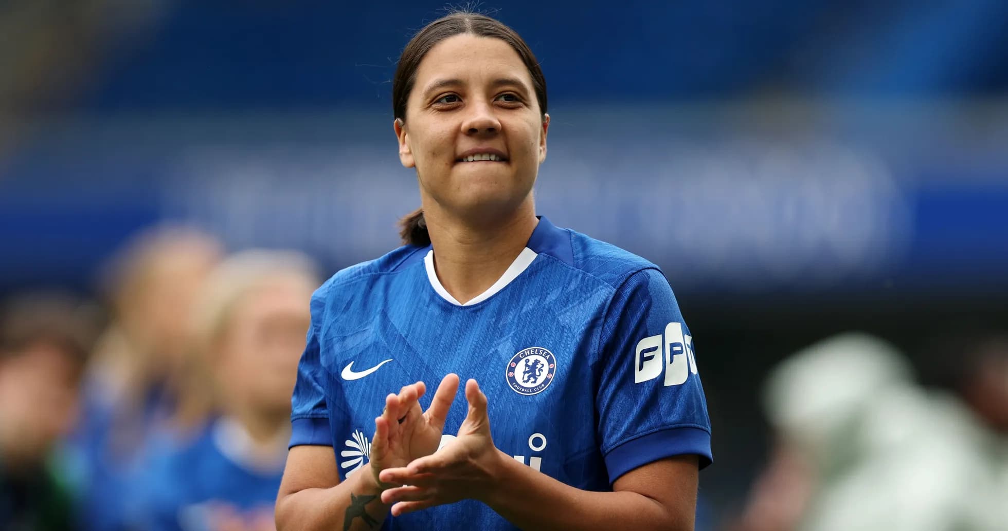 Chelsea player applauding during match warm-up