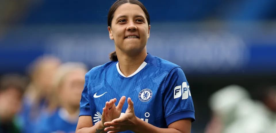 Chelsea player applauding during match warm-up