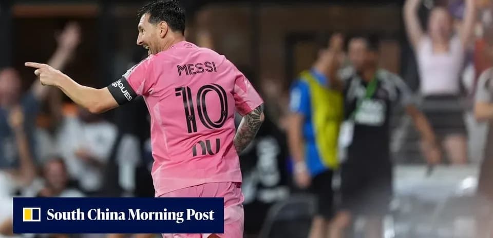 Player in pink jersey celebrating goal during match