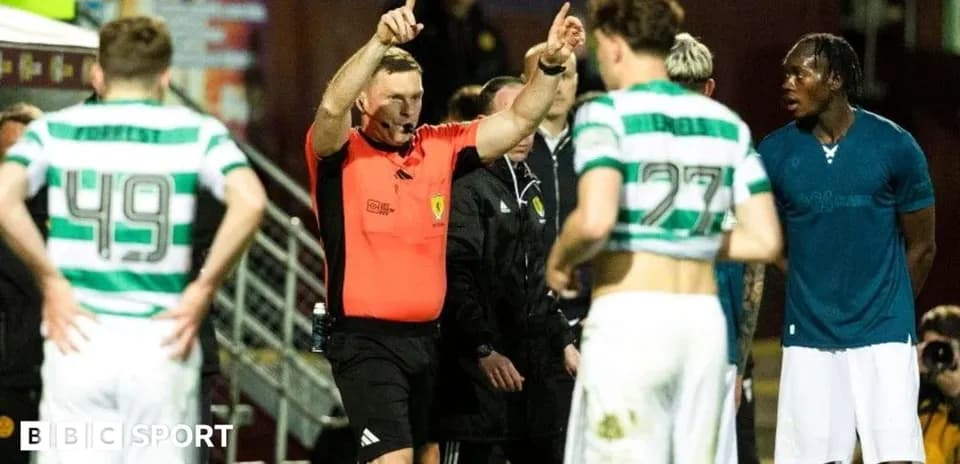 Referee issuing instructions to players during match