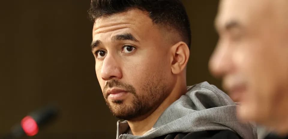 Player attending press conference with microphone in foreground