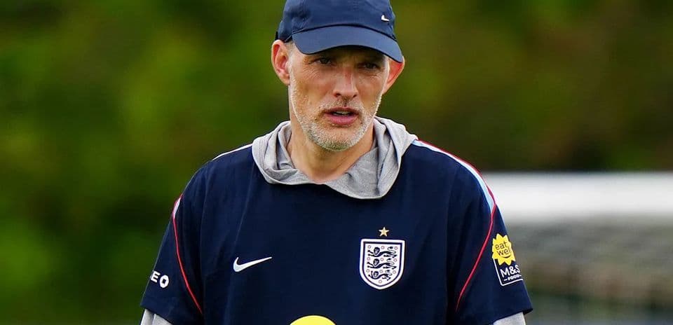 Coach observing players during training session
