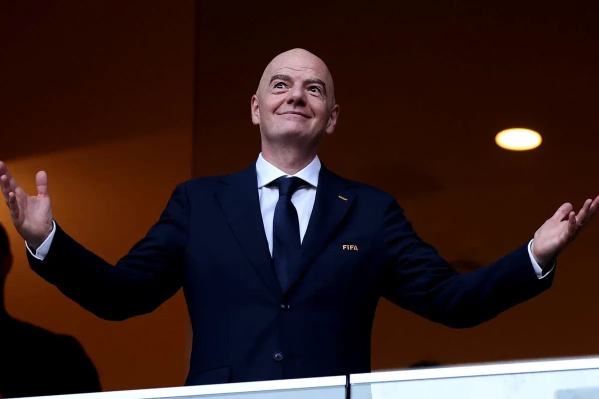 FIFA president gesturing from VIP box
