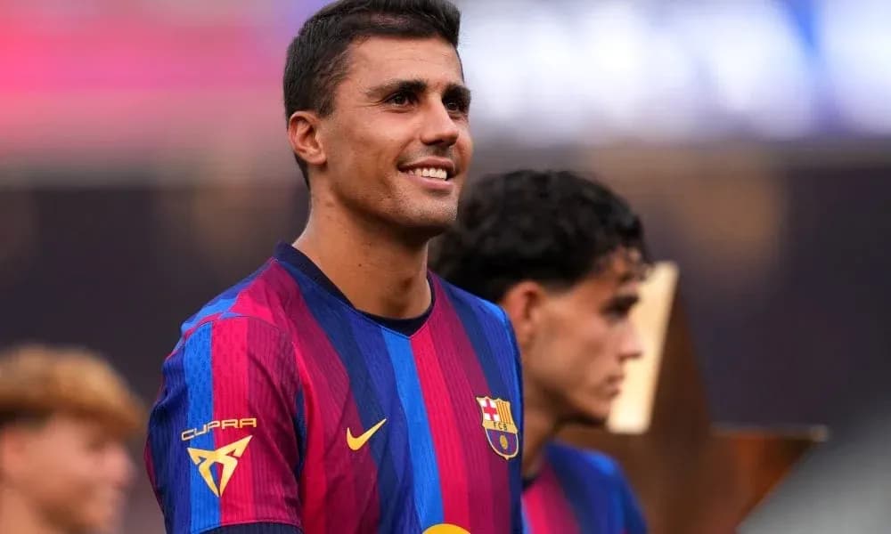 Player smiling while celebrating with teammates