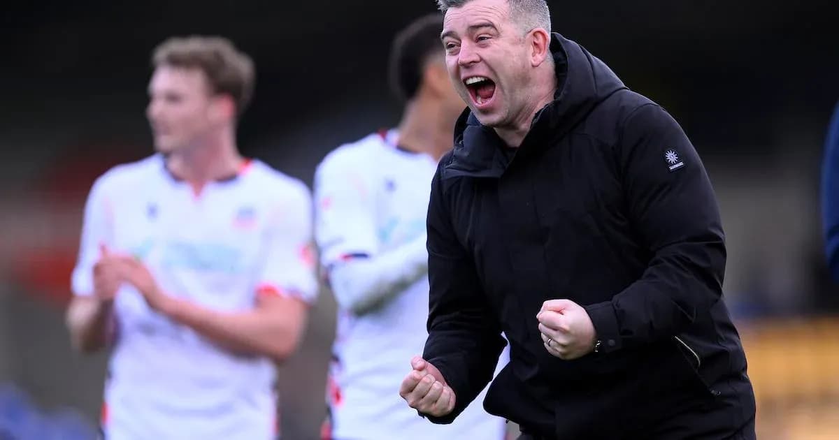 Coach celebrating with team after match victory