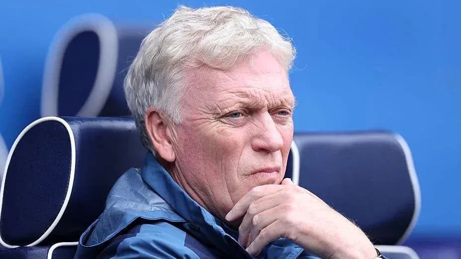 Coach sitting thoughtfully on the bench