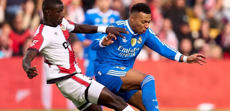 Player tackling opponent during a football match