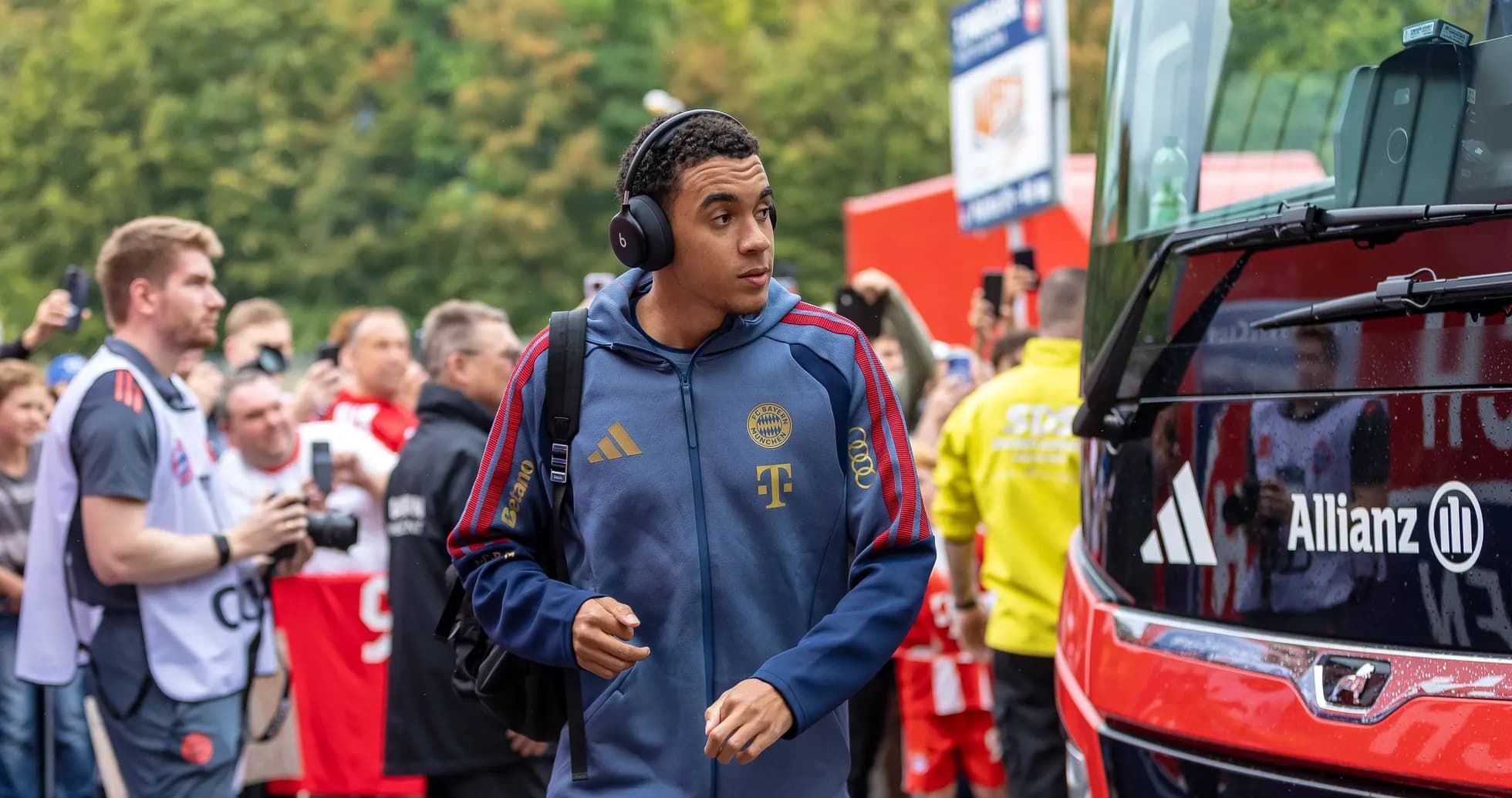 Player arriving at stadium with headphones on