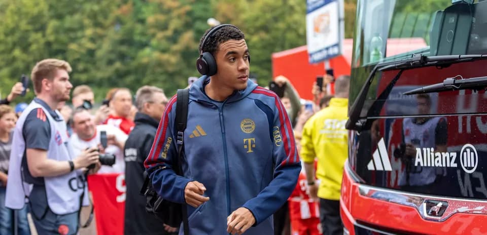 Player arriving at stadium with headphones on