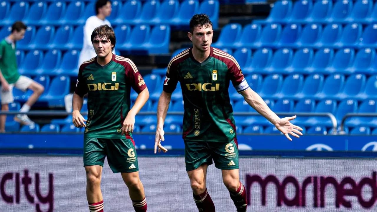 Oviedo players celebrating during a match