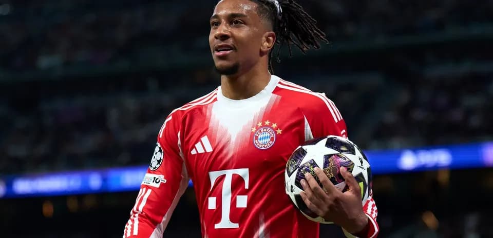 Bayern Munich player holding Champions League ball