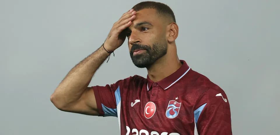 Player wearing maroon jersey with team logo