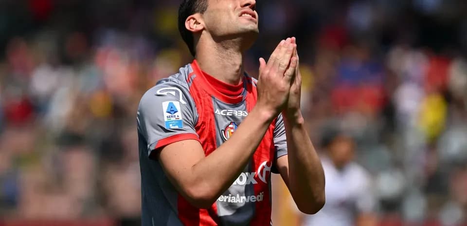 Player with hands clasped in prayer during match