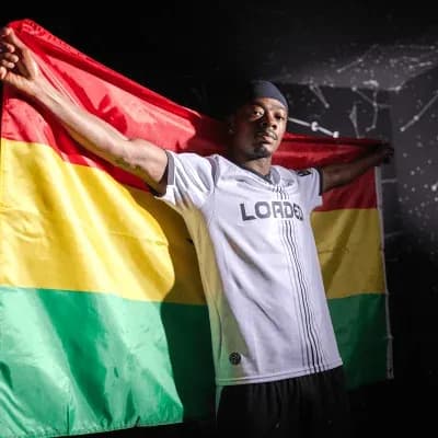 Player holding a flag during a photo shoot