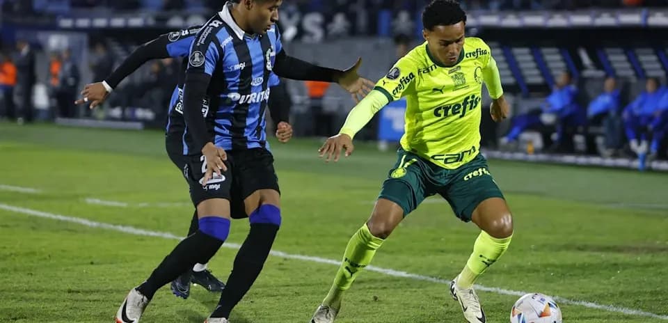 Two players competing for the ball on the field