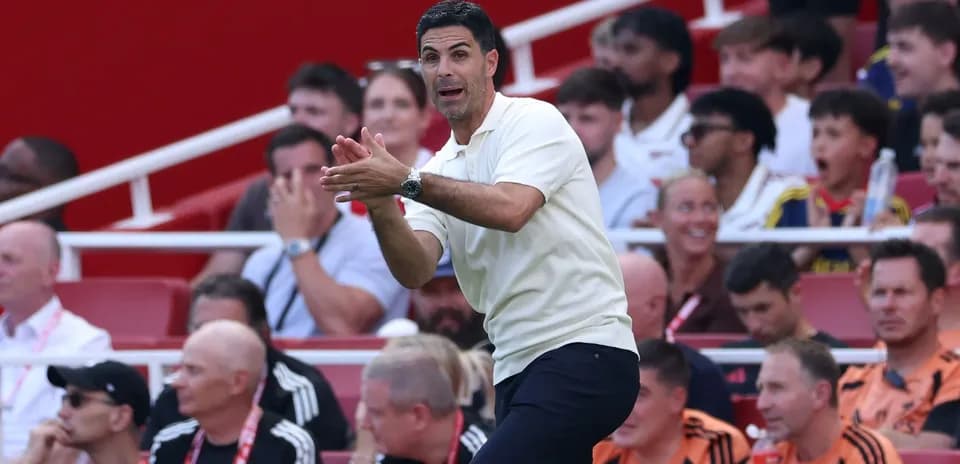 Coach gesturing from the sidelines during match