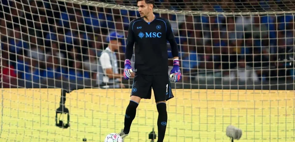 Goalkeeper standing in front of the goal during match