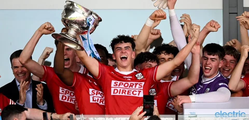Team celebrating with trophy after victory