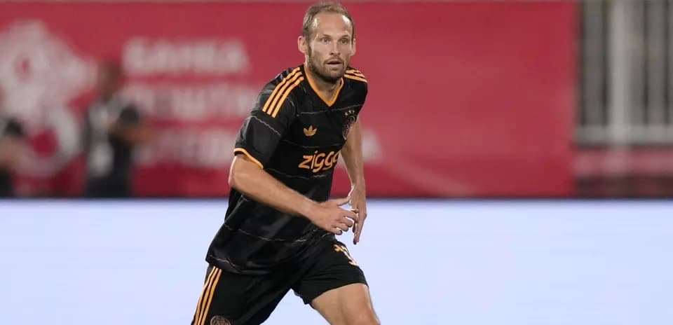 Player in black jersey running during match