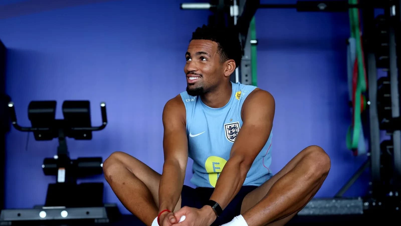 Player stretching in gym during training session