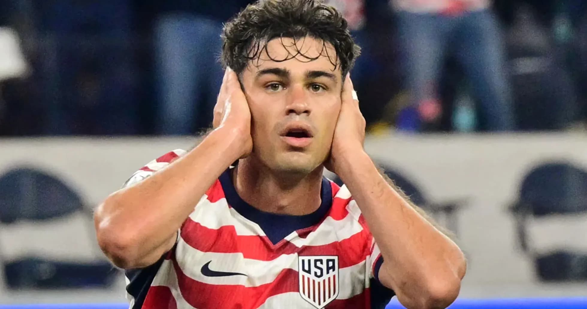 Player reacting during a match, hands on head