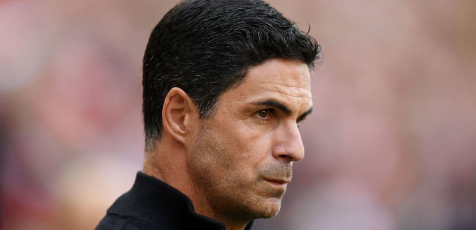 Manager focused during a match on the sidelines
