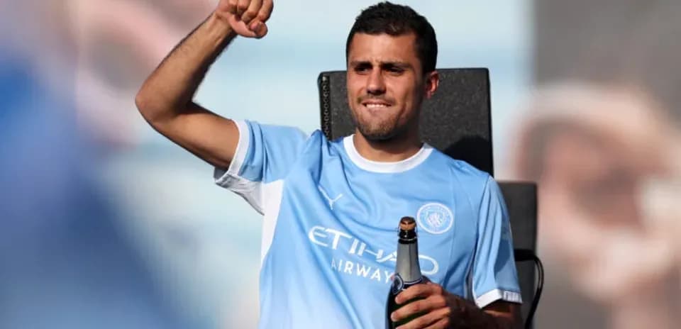Player celebrating with champagne at event