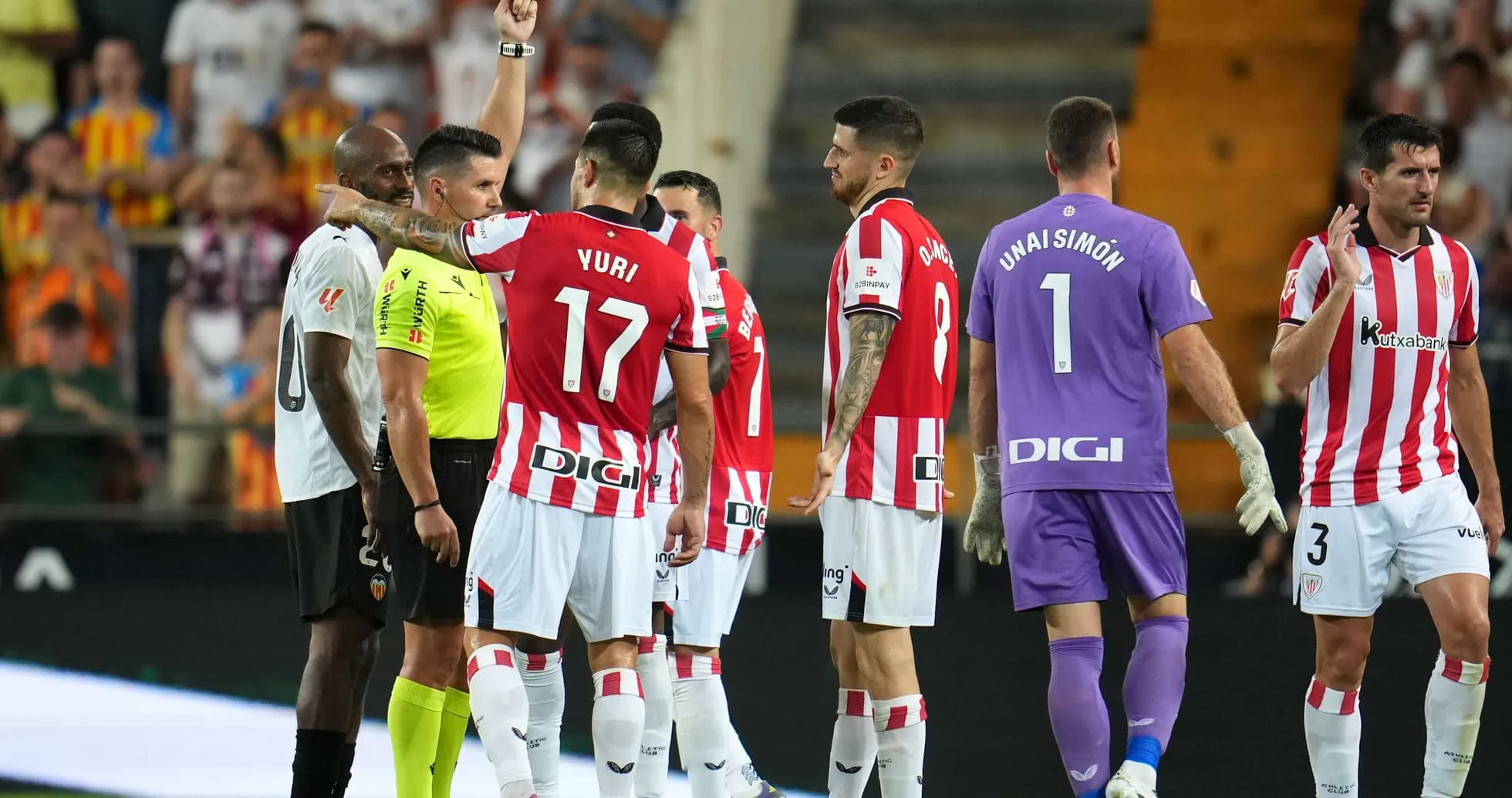 Players reacting to red card decision during match