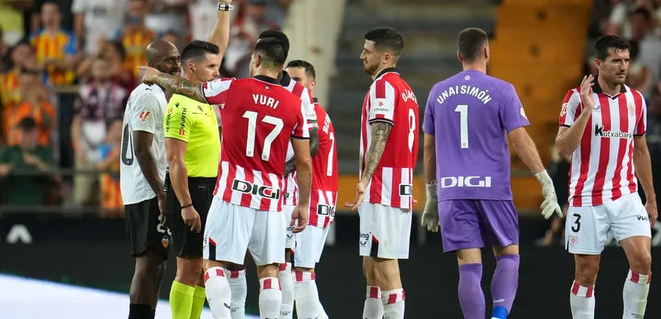 Players reacting to red card decision during match