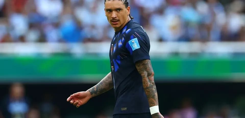 Player in blue jersey on football pitch