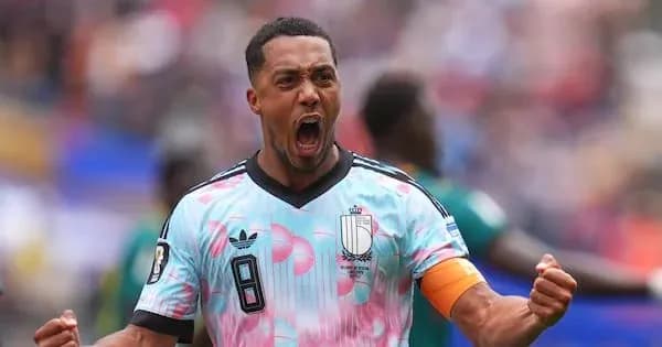 Player celebrating a goal in colorful jersey