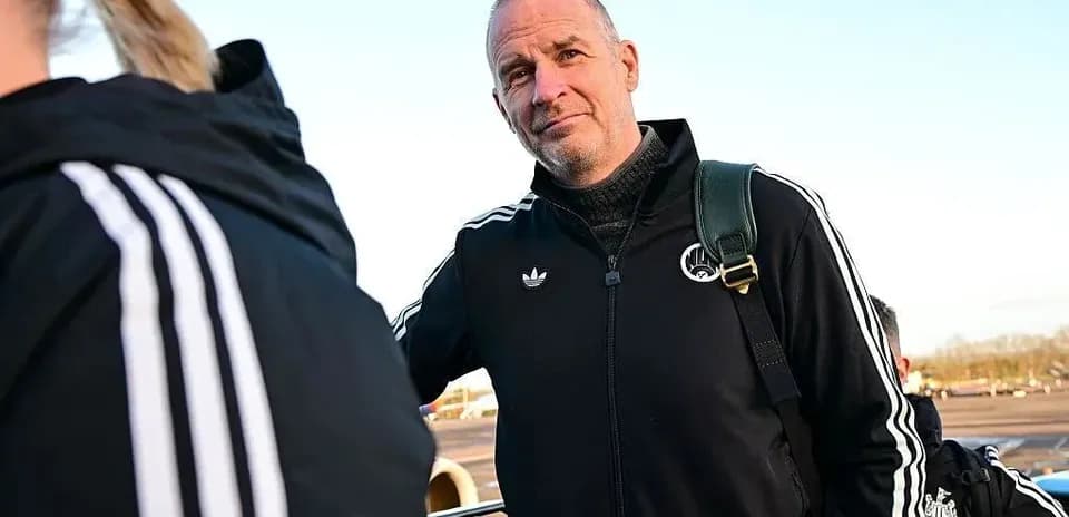 Coach in sportswear at airport departure area
