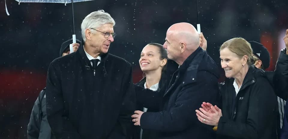 Group of officials talking under an umbrella