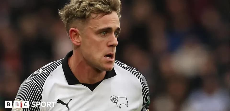 Player in Derby County kit running on the field