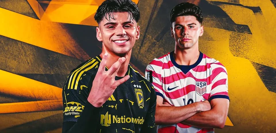 Two soccer players posing with team jerseys