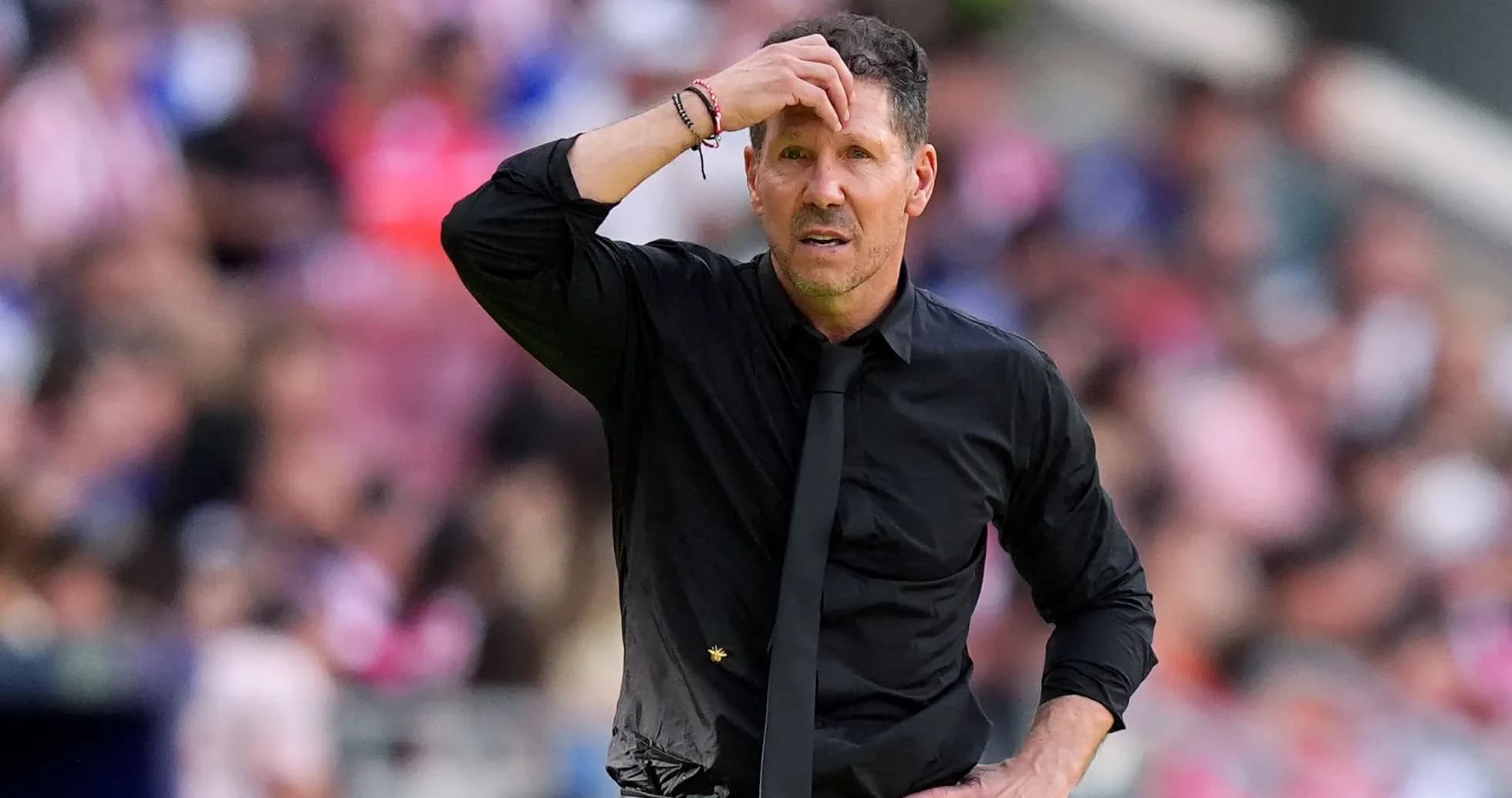 Coach looking concerned during a match