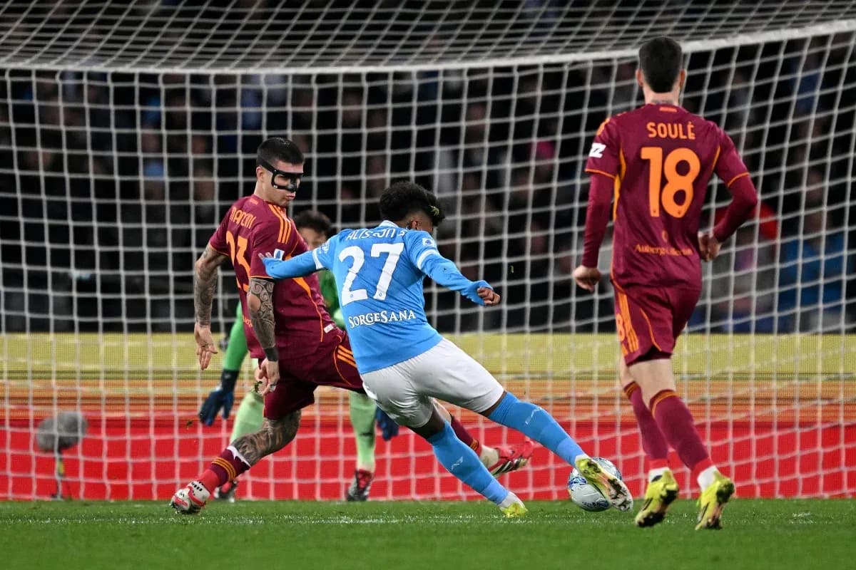 Napoli player challenging AS Roma defenders